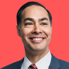 Julián Castro is wearing a blue suit, white shirt, and a boldly striped red tie, a gazing to the top right corner, and against a vivid red background.